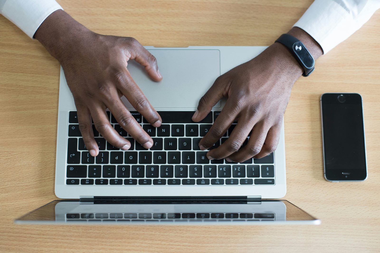 Finance professional working through figures on a laptop