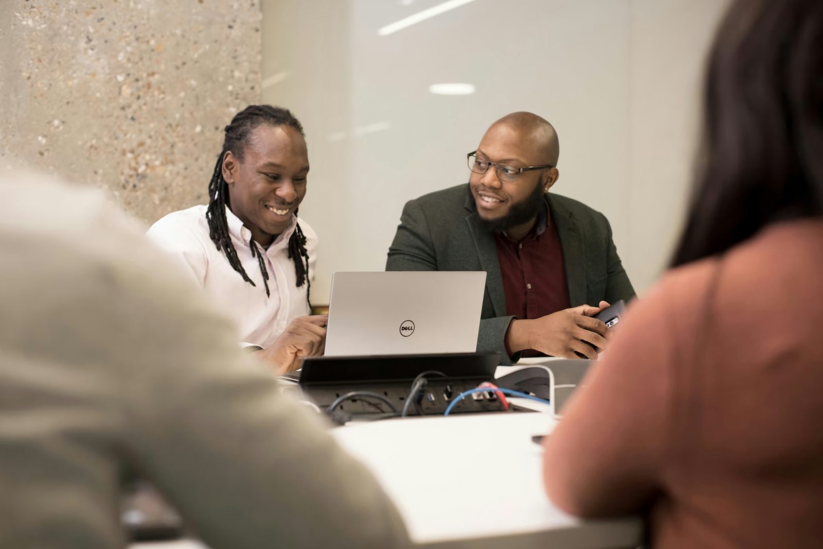 Finance professionals reviewing a payroll run